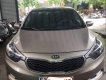 Kia K3 2014 - Bán Kia K3 năm 2014, màu vàng cát