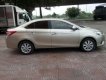 Toyota Vios E 2014 - Bán xe Toyota Vios E năm sản xuất 2014, màu vàng cát