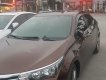 Toyota Corolla altis 1.8G MT 2015 - Bán Toyota Corolla altis 1.8G MT đời 2015, màu nâu, đẹp như mới