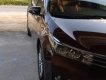 Toyota Corolla altis 1.8G MT 2015 - Bán Toyota Corolla altis 1.8G MT đời 2015, màu nâu, đẹp như mới