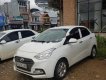 Hyundai Grand i10   1.2 MT 2018 - Bán ô tô Hyundai Grand i10 1.2 MT sản xuất 2018, màu trắng, mua tháng 4/2018