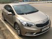 Kia K3 2015 - Cần bán lại xe Kia K3 đời 2015, màu vàng