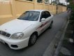 Daewoo Lanos SX 2004 - Gia đình cần bán Daewoo Lanos SX đời 2004, màu trắng, giá 72tr