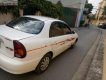 Daewoo Lanos SX 2004 - Gia đình cần bán Daewoo Lanos SX đời 2004, màu trắng, giá 72tr