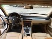 BMW 3 Series 320i 2007 - Cần bán xe BMW 320i 2007 màu trắng, nội thất kem