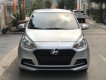 Hyundai Grand i10  1.2 MT Base 2018 - Cần bán lại xe Hyundai Grand i10 1.2 MT Base năm sản xuất 2018, màu bạc  