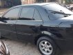 Mazda 323 Classic GLX 2004 - Bán gấp Mazda 323 Classic GLX sản xuất năm 2004, màu đen  