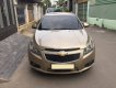 Chevrolet Cruze 2010 - Gia đình cần bán Cruze 2010, số sàn, màu vàng cát