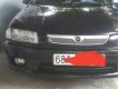 Mazda 323  MT 2000 - Cần bán gấp Mazda 323 MT năm sản xuất 2000, màu đen, xe nhà ít đi