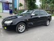 Mazda 323 2003 - Cần bán xe Mazda 323 đời 2003, màu đen, xe đẹp 