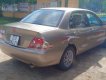Mitsubishi Lancer 2003 - Bán Mitsubishi Lancer sản xuất năm 2003, màu vàng, nhập khẩu