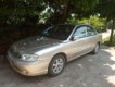 Kia Spectra 2005 - Bán xe Kia Spectra năm sản xuất 2005, màu vàng cát