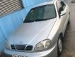 Daewoo Lanos 2003 - Cần bán gấp Daewoo Lanos sản xuất 2003, màu bạc