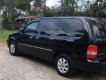 Kia Carnival GS 2006 - Bán xe Kia Carnival GS năm 2006, màu đen, xe gia đình chính chủ sử dụng, dòng xe hạng sang cao cấp