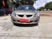 Mitsubishi Lancer 2004 - Bán Mitsubishi Lancer đời 2004, màu vàng, xe nhập xe gia đình