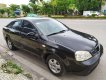 Daewoo Lacetti EX 2005 - Nhà bán Daewoo Lacetti EX đời 2005, màu đen số sàn