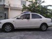 Mazda 323 1999 - Cần bán gấp Mazda 323 sản xuất năm 1999, màu trắng, nhập khẩu