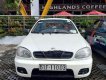 Daewoo Lanos SX 2002 - Cần bán gấp Daewoo Lanos SX đời 2002, màu trắng xe gia đình  