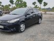 Toyota Vios 1.5E 2014 - Cần bán lại Toyota Vios E năm sản xuất 2014, màu đen, số sàn