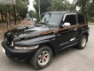 Ssangyong Korando 2004 - Bán xe Ssangyong Korando TX5 AT 4WD năm 2004, màu đen, xe nhập