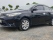 Toyota Vios 1.5E 2014 - Cần bán lại Toyota Vios E năm sản xuất 2014, màu đen, số sàn