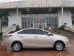 Toyota Vios 2015 - Cần bán gấp Toyota Vios 1.5E sản xuất 2015, màu vàng xe còn mới lắm