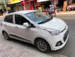 Hyundai Grand i10 2016 - Cần bán lại xe Hyundai Grand i10 1.2 MT năm sản xuất 2016, màu trắng, nhập khẩu xe gia đình, 310tr