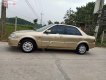 Ford Laser Delu 1.6 MT 2001 - Cần bán gấp Ford Laser MT đời 2001, màu vàng xe gia đình