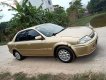 Ford Laser Delu 1.6 MT 2001 - Cần bán gấp Ford Laser MT đời 2001, màu vàng xe gia đình