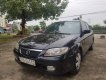 Mazda 323 2002 - Cần bán lại xe Mazda 323 đời 2001, màu đen, nhập khẩu nguyên chiếc chính chủ