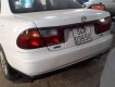 Mazda 323    1999 - Cần bán lại xe Mazda 323 sản xuất năm 1999, màu trắng giá cạnh tranh