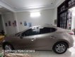 Mazda 3 2016 - Cần bán gấp Mazda 3 đời 2016, màu vàng cát, số tự động, giá chỉ 565 triệu