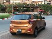 Hyundai Grand i10 AT 2015 - Cần bán lại xe Hyundai Grand i10 AT đời 2015, màu nâu, số tự động, 305tr