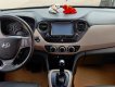 Hyundai Grand i10 AT 2015 - Cần bán lại xe Hyundai Grand i10 AT đời 2015, màu nâu, số tự động, 305tr