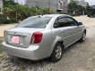 Daewoo Lacetti 2009 - Cần bán Daewoo Lacetti đời 2009, màu bạc