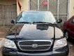 Kia Carnival 2.5 MT 2005 - Cần bán Kia Carnival 2.5 MT sản xuất 2005, màu đen, nhập khẩu, 225 triệu