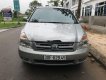 Kia Carnival   2010 - Cần bán gấp Kia Carnival 2010, màu bạc, nhập khẩu