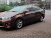 Toyota Corolla altis 1.8 2015 - Bán xe Toyota Corolla altis 1.8 đời 2015, màu nâu, số tự động, 595tr