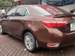 Toyota Corolla altis 1.8 2015 - Bán xe Toyota Corolla altis 1.8 đời 2015, màu nâu, số tự động, 595tr