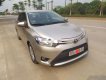 Toyota Vios 2014 - Cần bán lại xe Toyota Vios đời 2014, màu vàng cát, giá chỉ 310 triệu