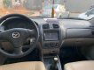 Mazda 323F 2004 - Cần bán gấp Mazda 323F GLX đời 2004, màu trắng