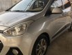 Hyundai Grand i10 2015 - Cần bán lại chiếc Hyundai Grand i10 AT hatchback sản xuất 2015, màu bạc, nhập khẩu nguyên chiếc