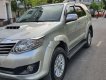 Toyota Fortuner 2014 - Cần bán gấp Toyota Fortuner MT năm 2014, màu bạc như mới