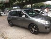 Kia Carens   2010 - Bán xe cũ Kia Carens SX 2.0 AT đời 2010, màu nâu