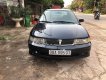 Mitsubishi Lancer GLXI 1.6 MT 2003 - Cần bán Mitsubishi Lancer GLXI 1.6 MT sản xuất 2003, màu xanh lam xe gia đình