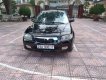 Mazda 323 2004 - Bán ô tô Mazda 323 2004, màu đen