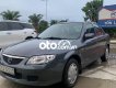 Mazda 323    2001 - Cần bán xe Mazda 323 đời 2001, màu xám, xe nhập còn mới