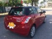 Suzuki Swift 1.4AT  2014 - Cần bán gấp Suzuki Swift 1.4AT đời 2014, màu đỏ số tự động, giá 348tr