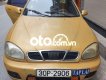 Daewoo Lanos 2002 - Cần bán lại xe Daewoo Lanos sản xuất 2002, màu vàng, nhập khẩu nguyên chiếc