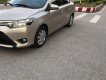 Toyota Vios   1.5 E  2015 - Cần bán Toyota Vios 1.5 E 2015, màu vàng